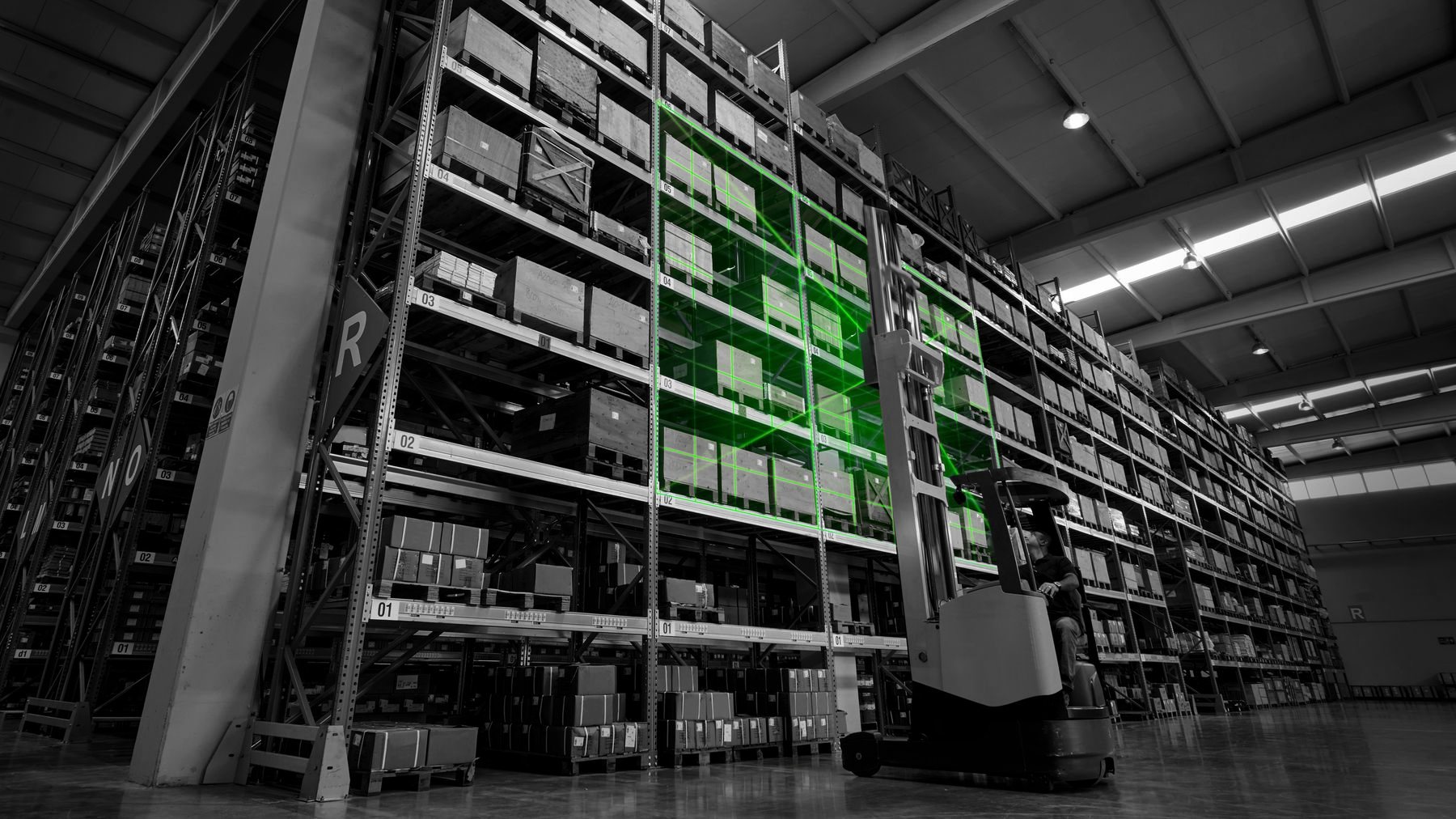 A reach truck driving a high bay aisle while the Sentispec scan field reads a full bay of pallets